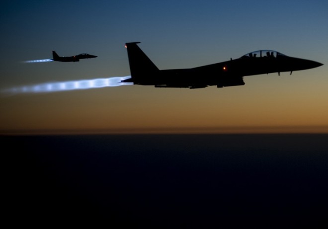 A pair of U.S. Air Force F-15E Strike Eagles fly over northern Iraq