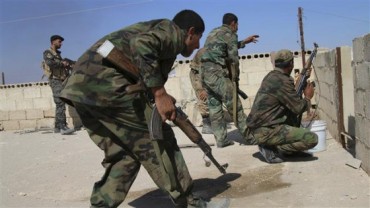 Syrian-soldiers-fire-shots-to-repel-a-militant-attack-by-Takfiri-Daesh-terrorists-on-Achan-district-in-Syria’s-central-province-of-Hama.